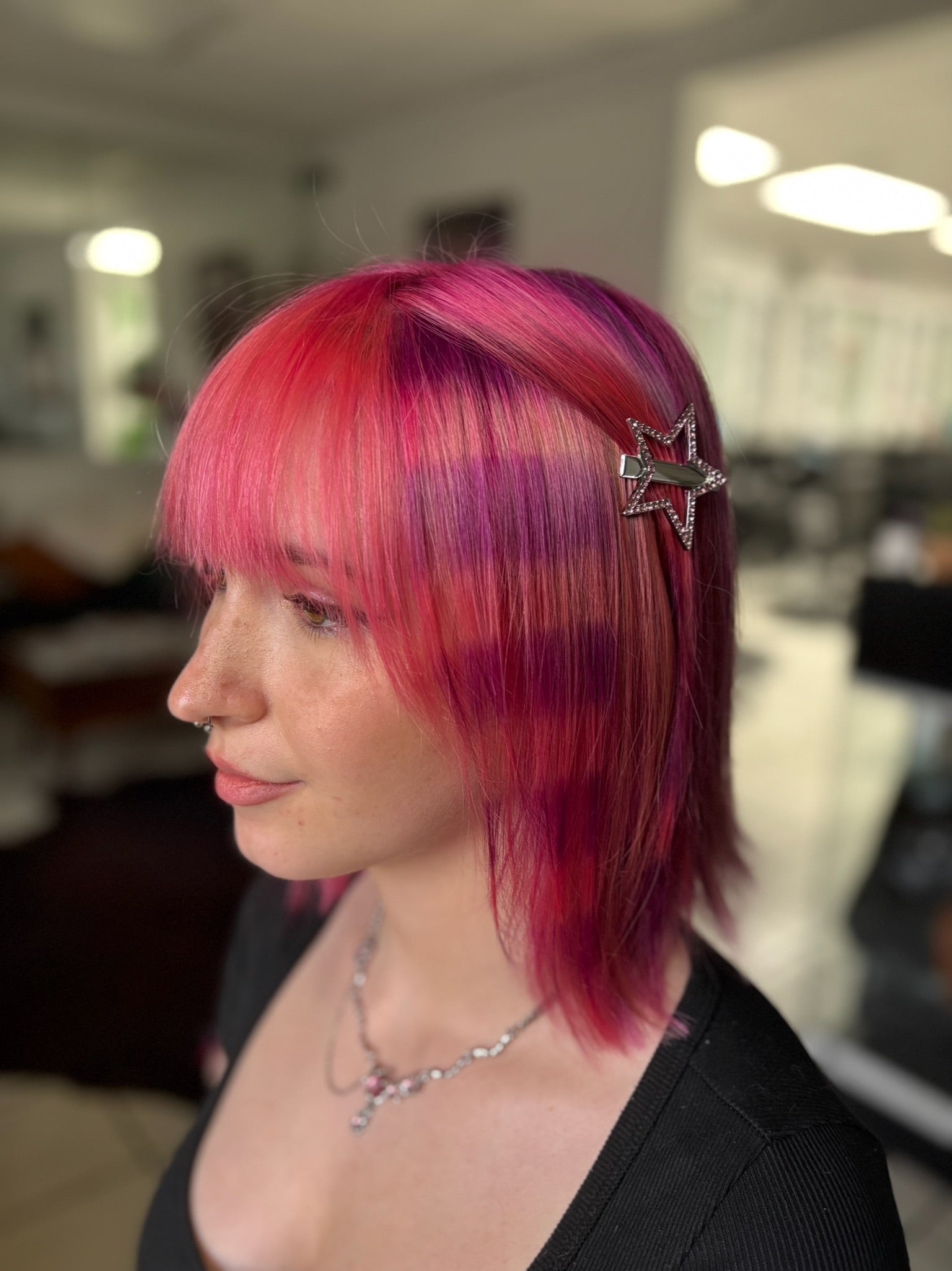 pink hair, purple stripes creating a raccoon tail, alternative hair, vivid hair