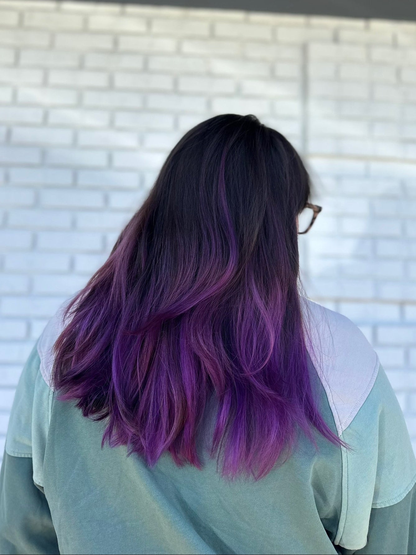dark wavy hair with purple gradient ends