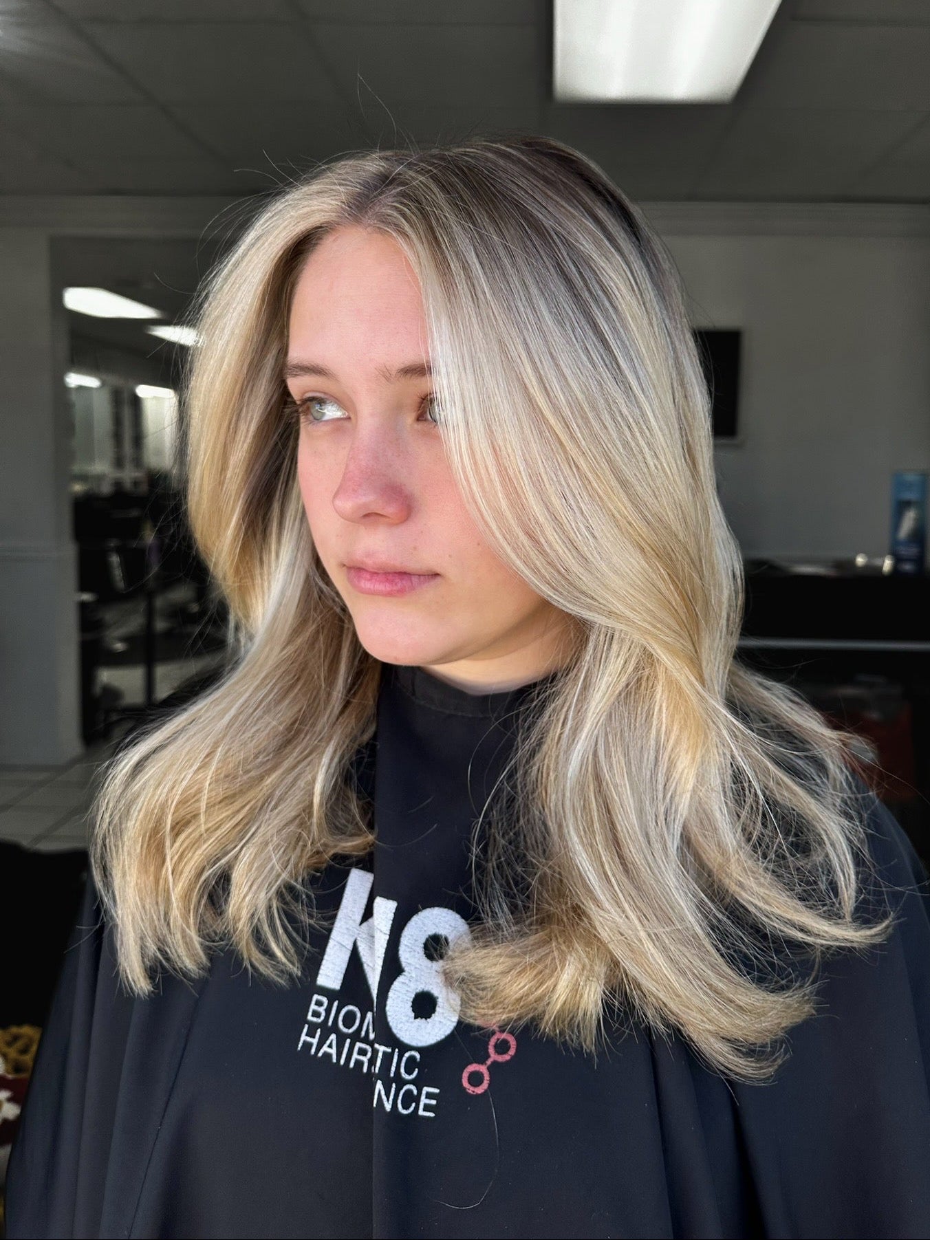 bright blonde highlights on slightly curled hair 